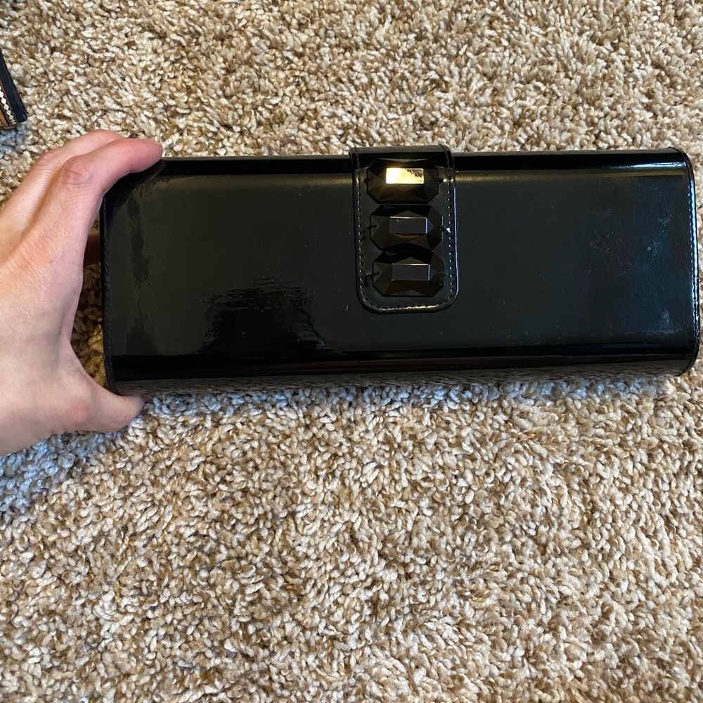 Black Lancôme clutch, magnetic closure